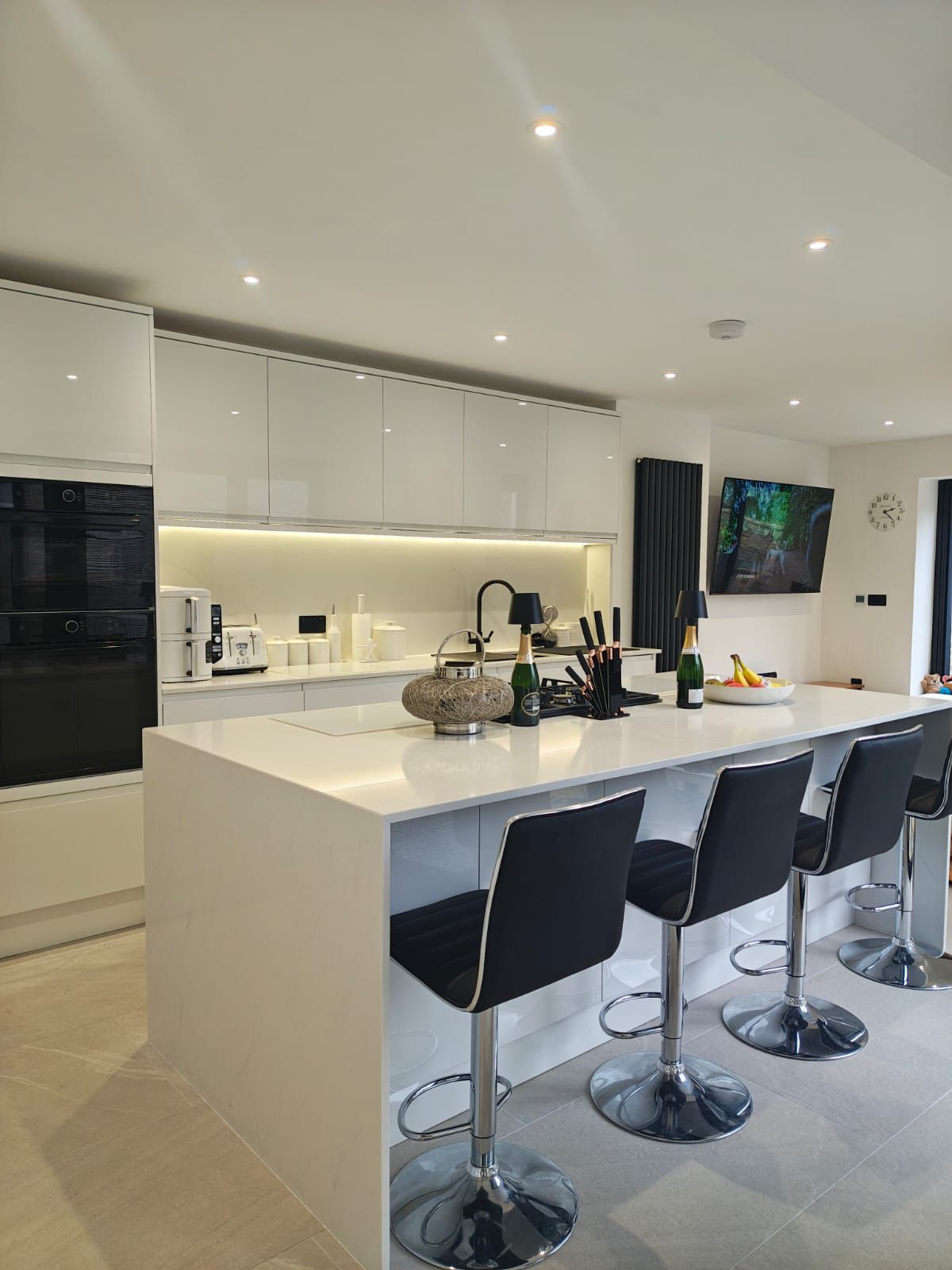 Kitchen island with downlights and under-cabinet LED lighting